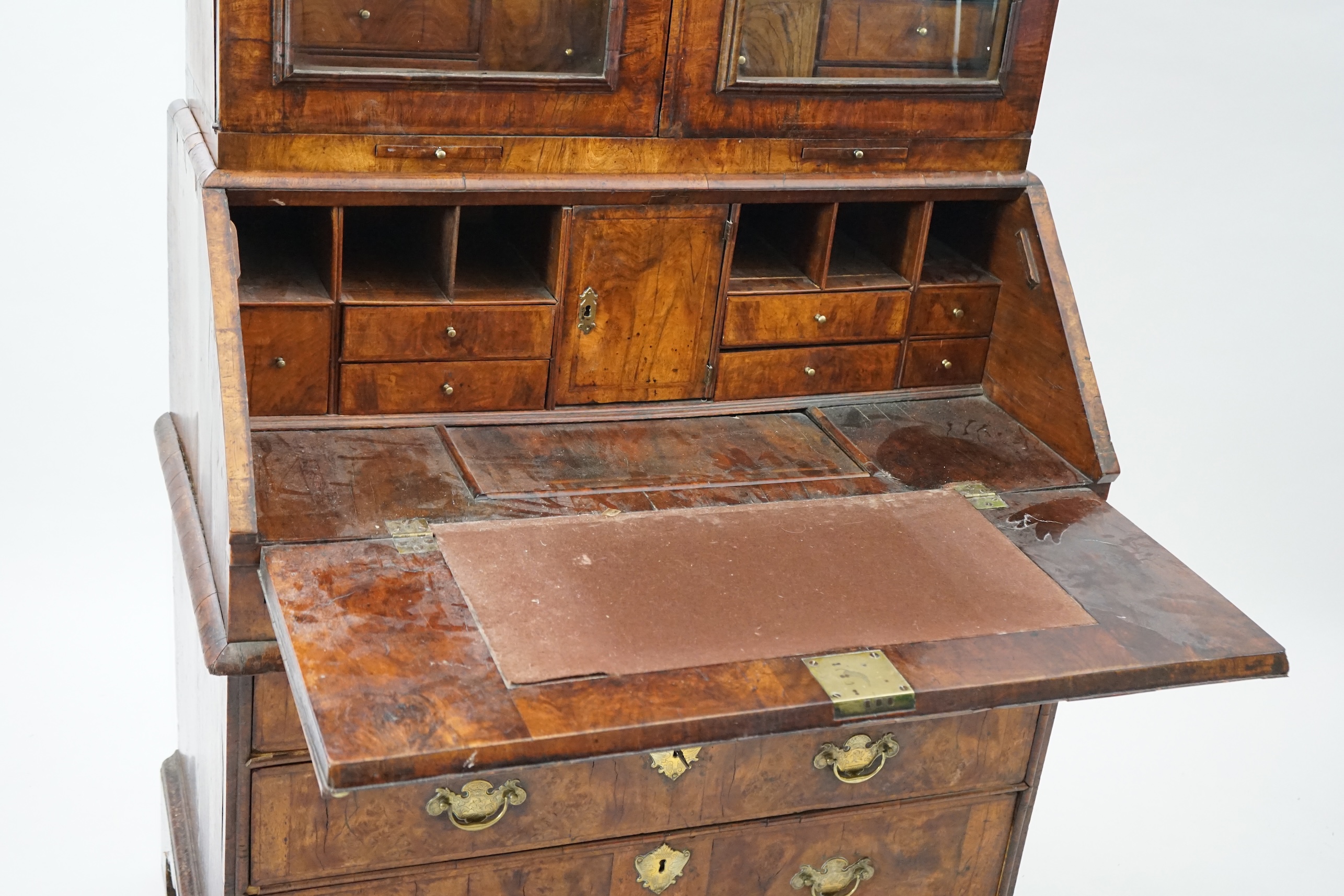 An early 18th century walnut bureau bookcase